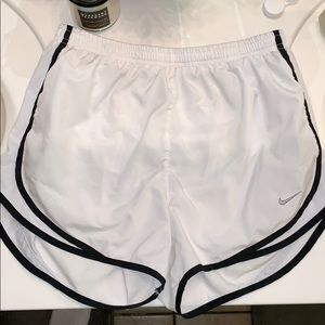 White Nike running shorts